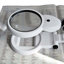 Load image into Gallery viewer, Compact hands-free folding desk magnifier, illuminated, 108mm lens
